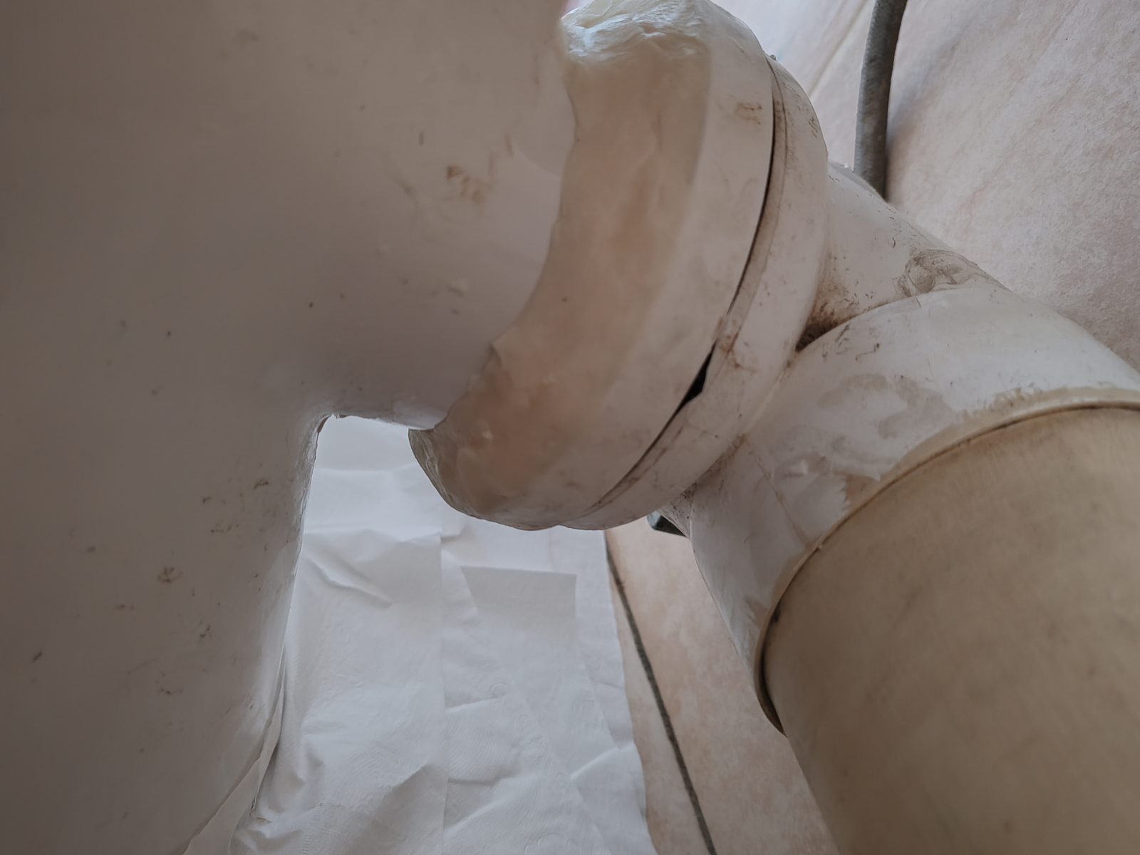 Plumbing repair close-up under basin or toilet area